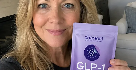 Customer holding a Thinveil pouch